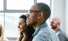 Corporate Team Listening on a Meeting