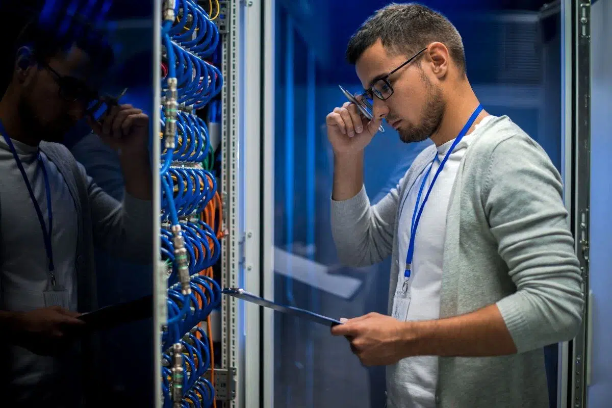 IT engineer checking cables