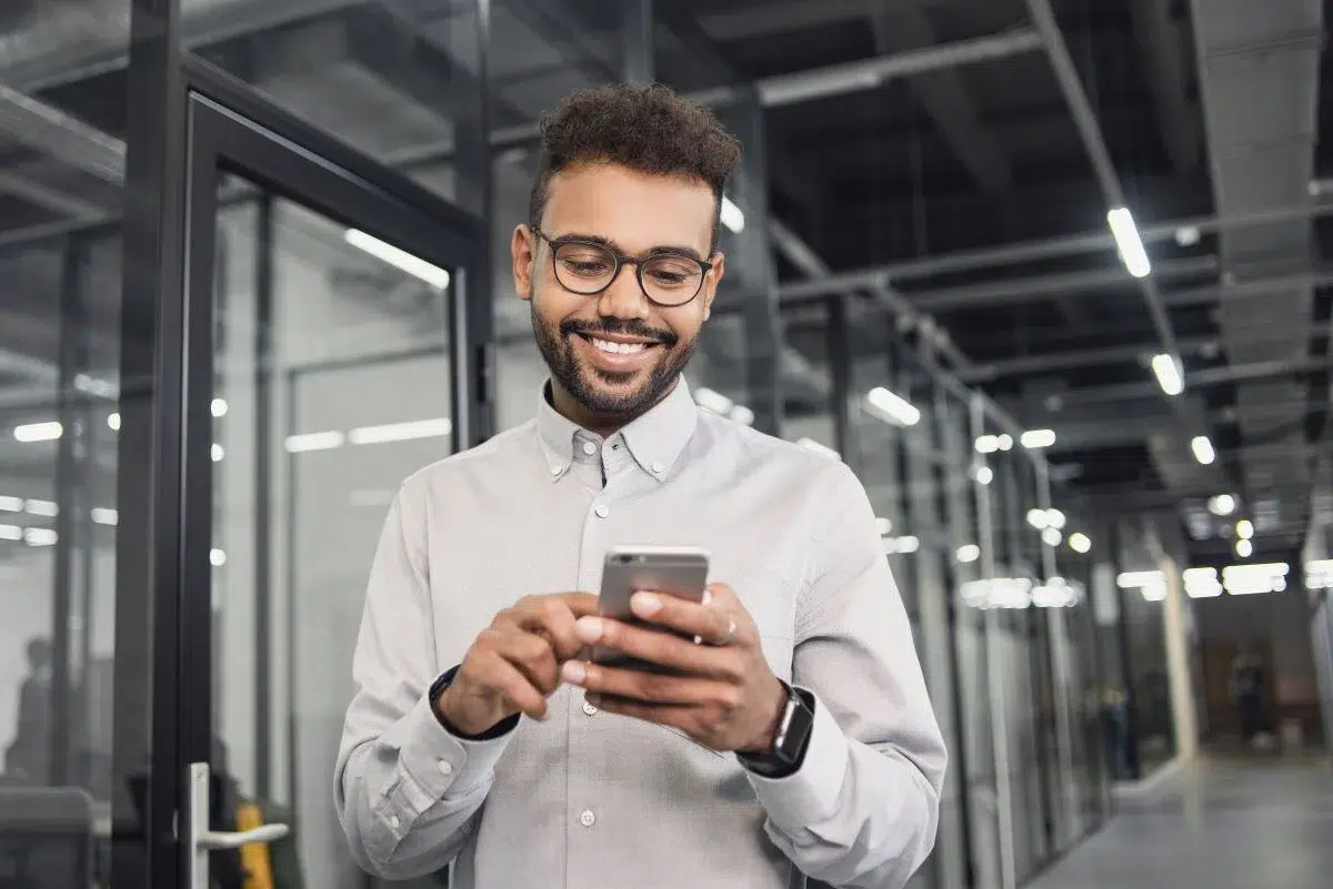 IT person checking his phone in the corporate office