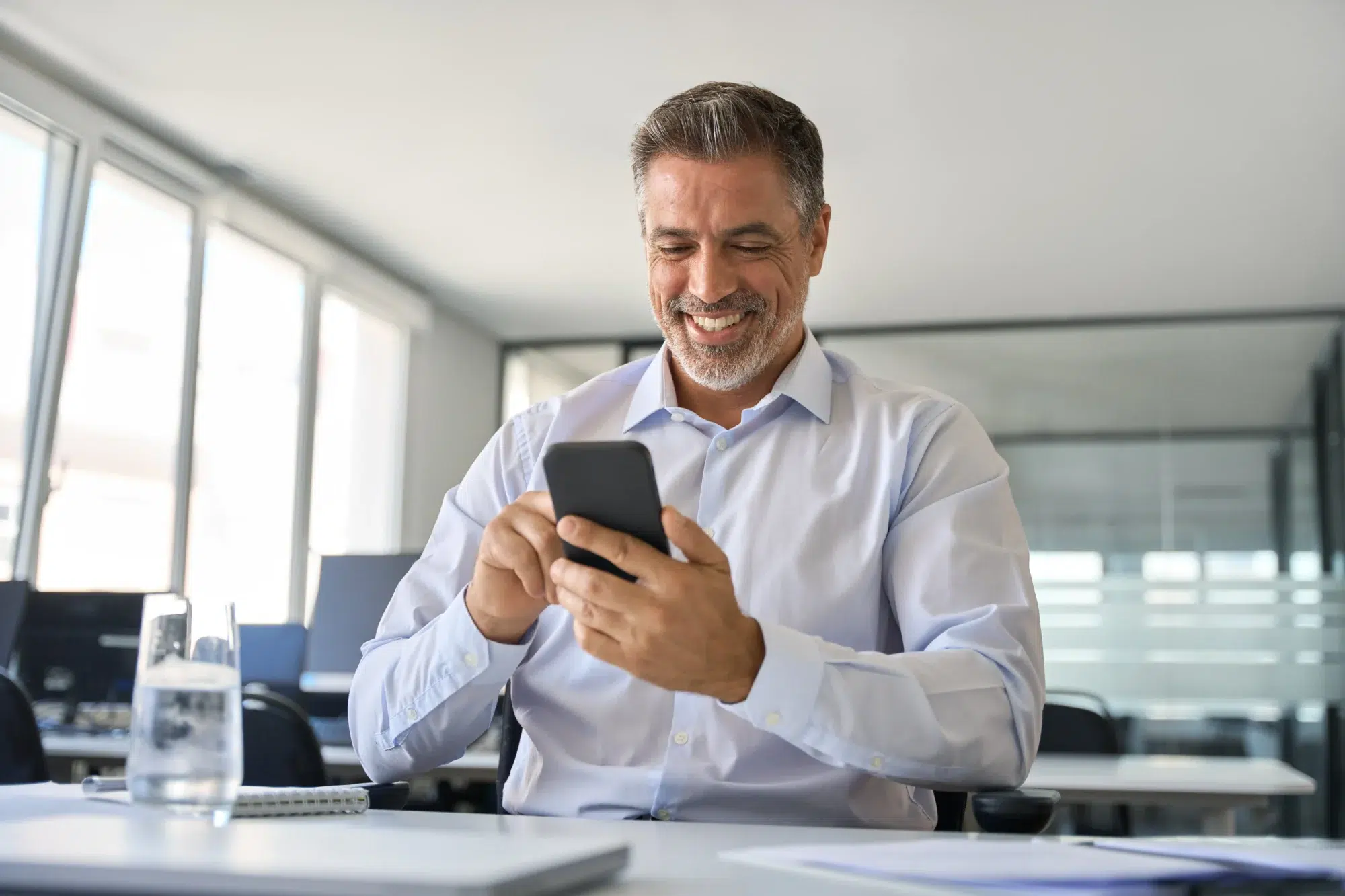 Man smiling after successful streamlining of mobility management